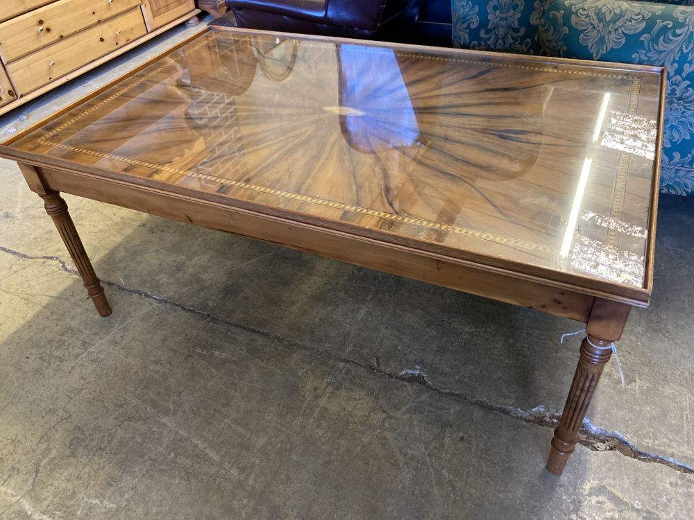 A reproduction rectangular inlaid yew coffee table, width 123cm, depth 78cm, height 52cm